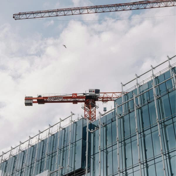 High-rise construction with crane illustrating building safety planning and structural coordination